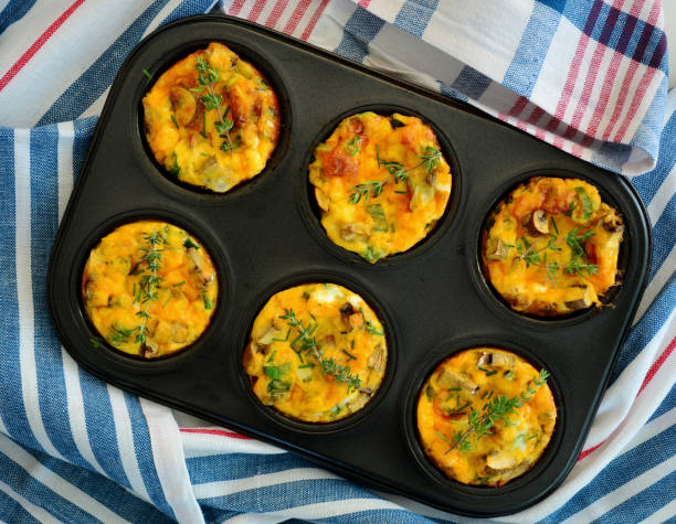 Denver Omelet breakfast muffins Denver Omelet breakfast muffins shot from overhead horizontal format muffin stock pictures, royalty-free photos & images