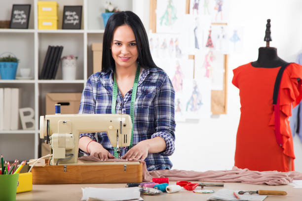 istock Young Beautiful fashion designer working in studio 1026834754