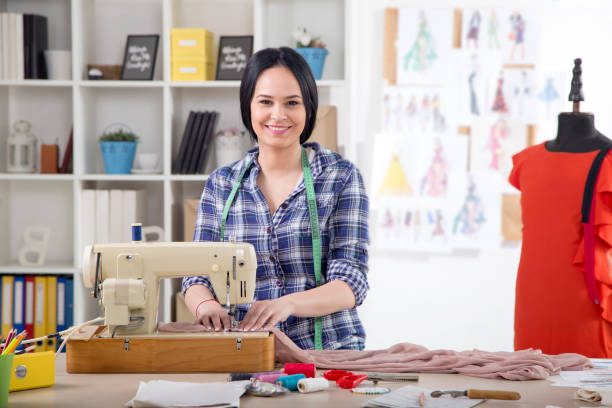 istock Young Beautiful fashion designer working in studio 1026834810