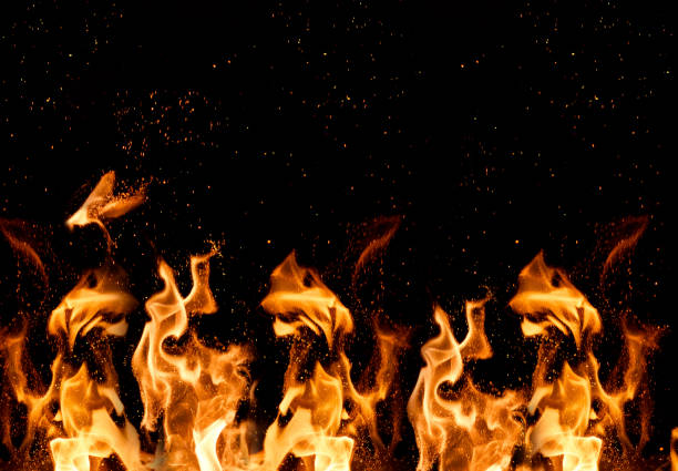 istock brightly burning orange flames with sparks 1026835034
