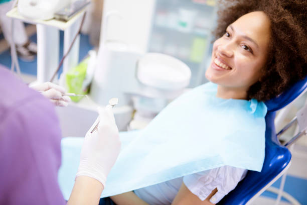 istock Young woman at the dentist 1026848178