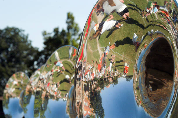 Marching band rehearsal mirrored in sousaphone Stillwater, OK, USA - September 21, 2005: A marching band rehearsal is mirrored in the sousaphone of an unidentified brass player high school soccer stock pictures, royalty-free photos & images