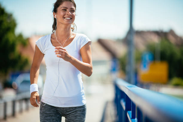 istock Young woman running outdoors 1026861540