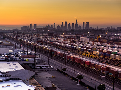 Aerial shot of an intermodal train and trucking distribution yard the city of Vernon, California. This is an industrial area surrounded by the City of Los Angeles, made up of factories, warehouses and meatpacking plants.