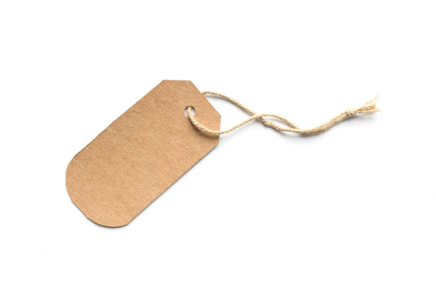 istock Blank brown cardboard price tag or label with thread isolated white background. 1026864576