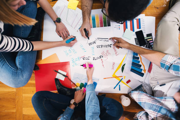 istock Close up of designers hands working on some new ideas for their work. 1026865308