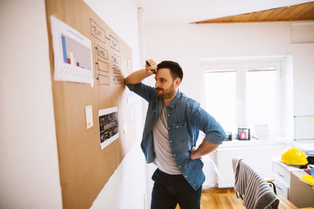 istock Tired focused businessman trying to solve some company problems. 1026867784