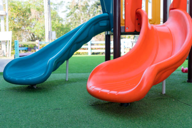 istock plastic slide on yard in park for the kid's playground 1026871634