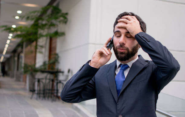 istock Concerned business man on a phonecall 1026871762