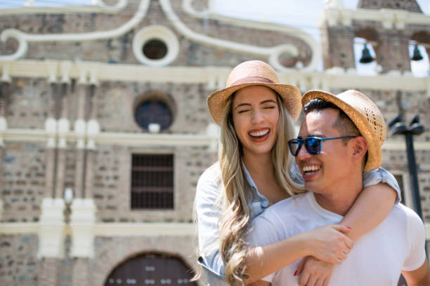 istock Happy man carrying his girlfriend on a piggyback ride 1026871854