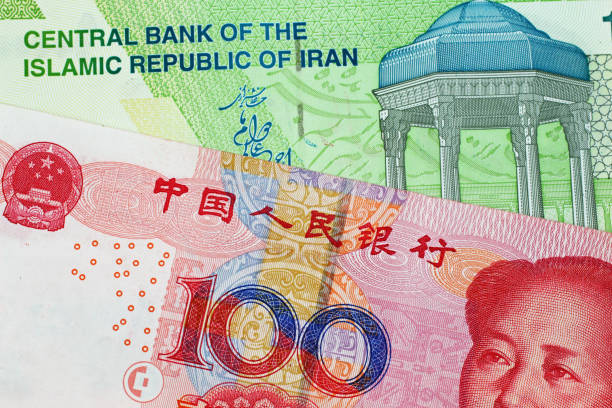 istock Chinese 100 Yuan Note With An Iranian 10000 Bank Note 1026878044
