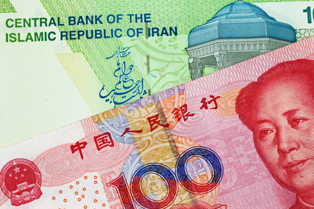 istock Chinese 100 Yuan Note With An Iranian 10000 Bank Note 1026878066