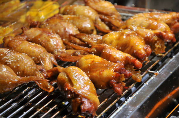 istock Chicken wings stuffed with shrimps on BBQ stand 1026880842