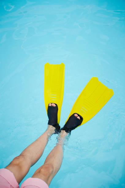 Man wearing swimming fins