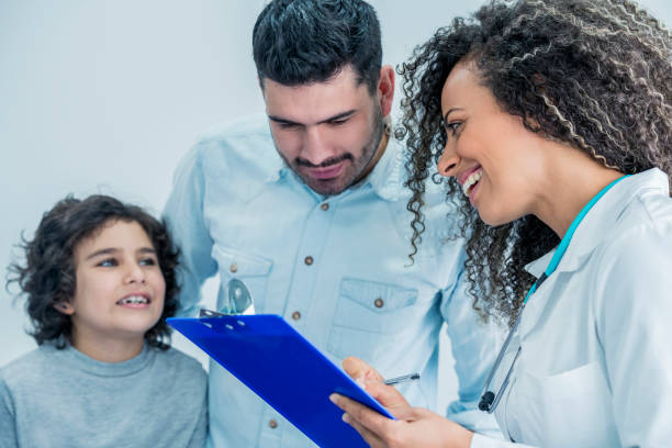 istock Dad and son receive instructions from the doctor 1026892278