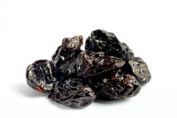 istock Prunes or dried plum on white background 1026902114