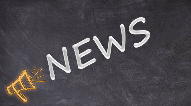 News written on blackboard yelled by megaphone