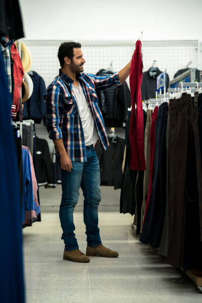 istock happy man doing his shopping in the mall 1026912566