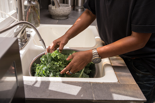 Rinsing kale with water generated from an alkaline machine.