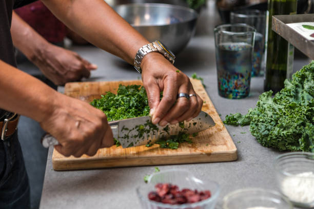 istock preparing and cutting kale to make a salad 1026918258