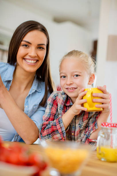 istock Mom and daughter having breakfast 1026936658
