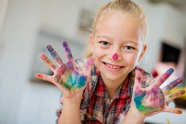 istock Young girl having fun coloring 1026936794