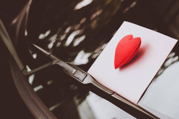 istock love letter heart on a sticky note under a windshield .vintage  color style 1026942308