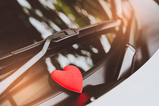 istock love letter heart on a sticky note under a windshield .vintage  color style 1026942322