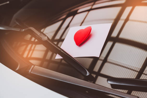 istock love letter heart on a sticky note under a windshield .vintage  color style 1026942326
