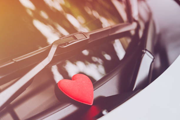 istock love letter heart on a sticky note under a windshield .vintage  color style 1026942334