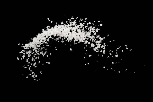 istock Salt splash explosion  isolated on black background , freeze stop motion 1026947596