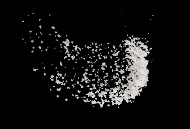 istock Salt splash explosion  isolated on black background , freeze stop motion 1026947802
