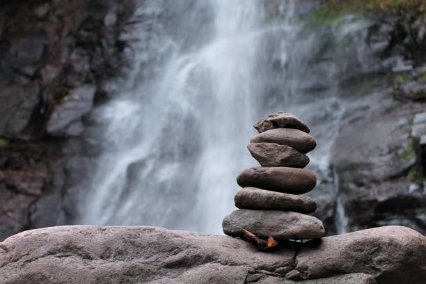 Rocks piled in front of a stream in New York forest