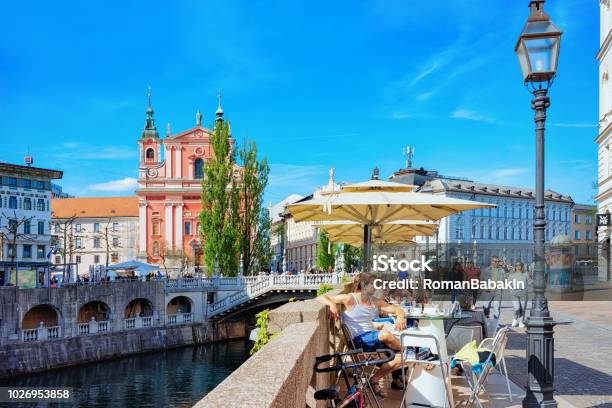People At Sidewalk Cafe On Triple Bridge Ljubljanica River Ljubljana Stock Photo - Download Image Now