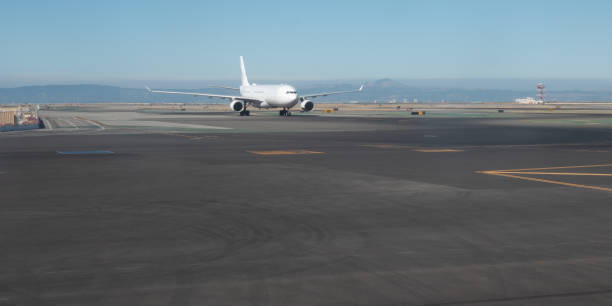 istock Comertial Airplane in the Runway About to Take off 1026954284