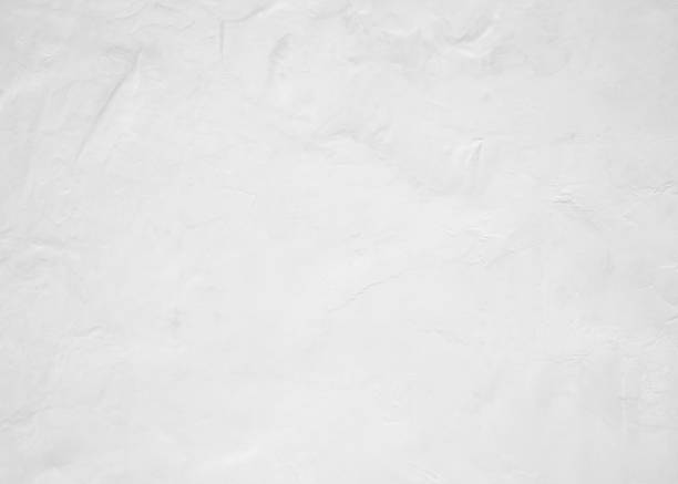 istock White pastel rough crack cement texture stone concrete,rock plastered stucco wall; painted flat fade background gray solid floor grain. 1026957456