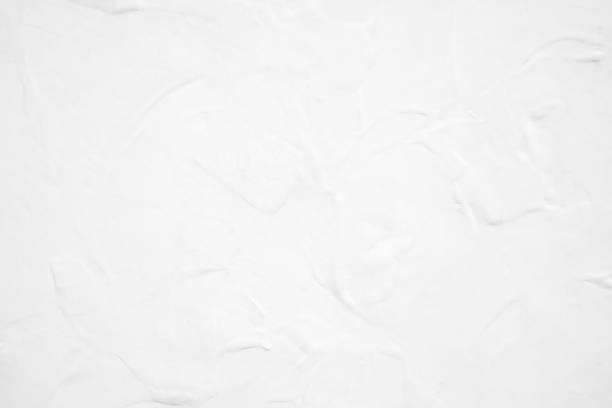 istock White pastel rough crack cement texture stone concrete,rock plastered stucco wall; painted flat fade background gray solid floor grain. 1026957496