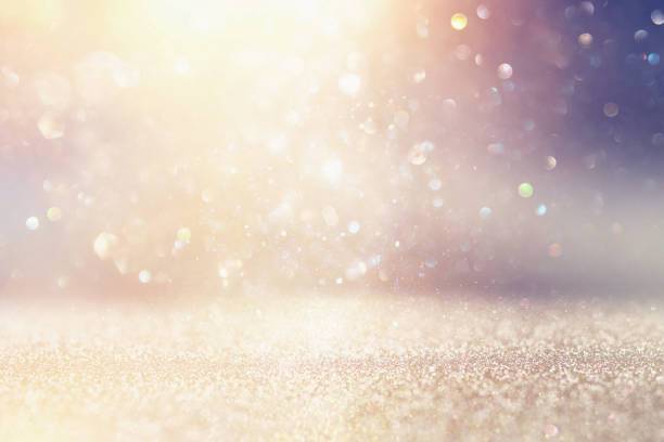 istock glitter vintage lights background. silver and white. de-focused. 1026960798