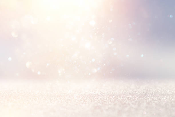 istock glitter vintage lights background. silver and white. de-focused. 1026960820