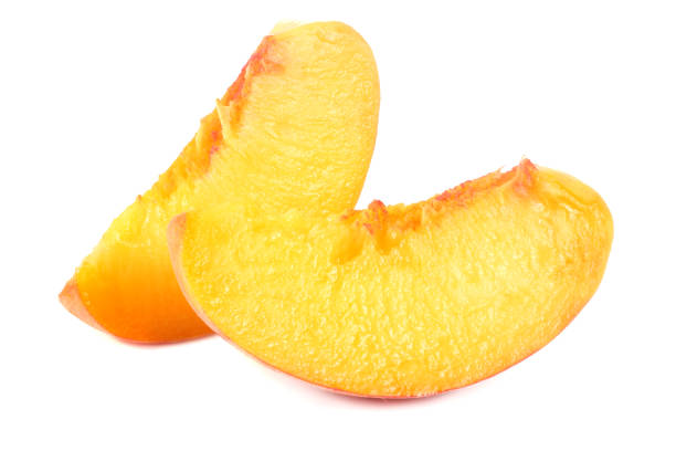 istock peach fruit slices isolated on white background 1026982360