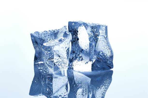istock Ice cubes with waterdrops melting on white background 1026983026