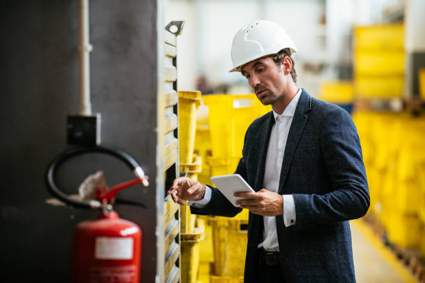 istock Quality inspector controlling production in factory 1026986908