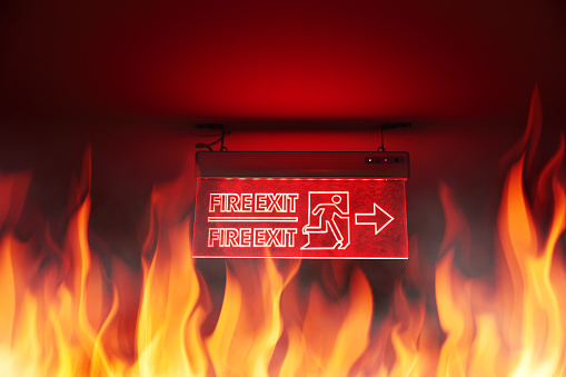 Building fire and Fire Exit sign emergency escape way