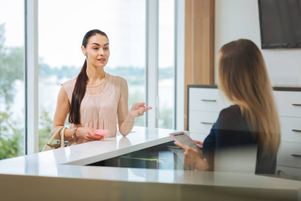 istock Nice beautiful young woman asking a question 1026993158