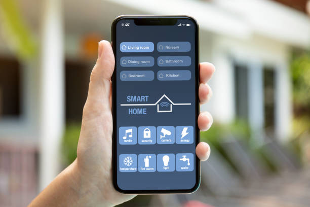 istock female hand holding phone with app smart home on screen 1026995634