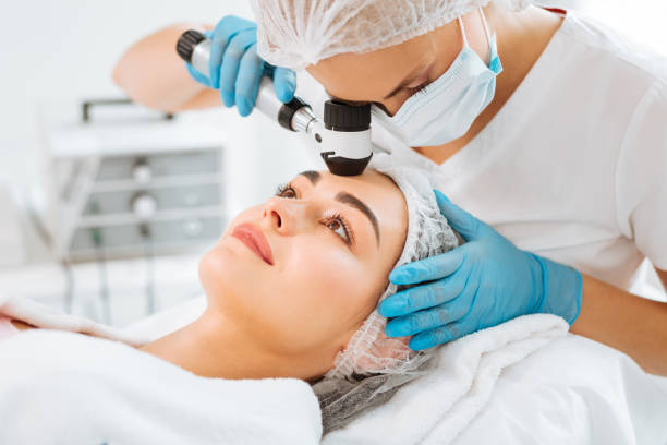 istock Pleasant young woman having her skin checked 1027002678
