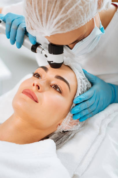 istock Professional experienced dermatologist looking into the dermoscope 1027002742