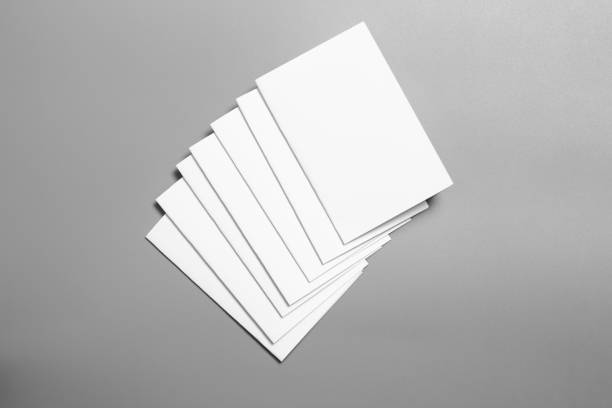 istock Blank portrait mock-up paper. brochure magazine isolated on gray, changeable background / white paper isolated on gray 1027002844