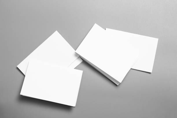 istock Blank portrait mock-up paper. brochure magazine isolated on gray, changeable background / white paper isolated on gray 1027002968