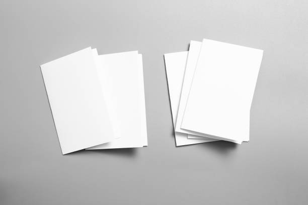 istock Blank portrait mock-up paper. brochure magazine isolated on gray, changeable background / white paper isolated on gray 1027004480